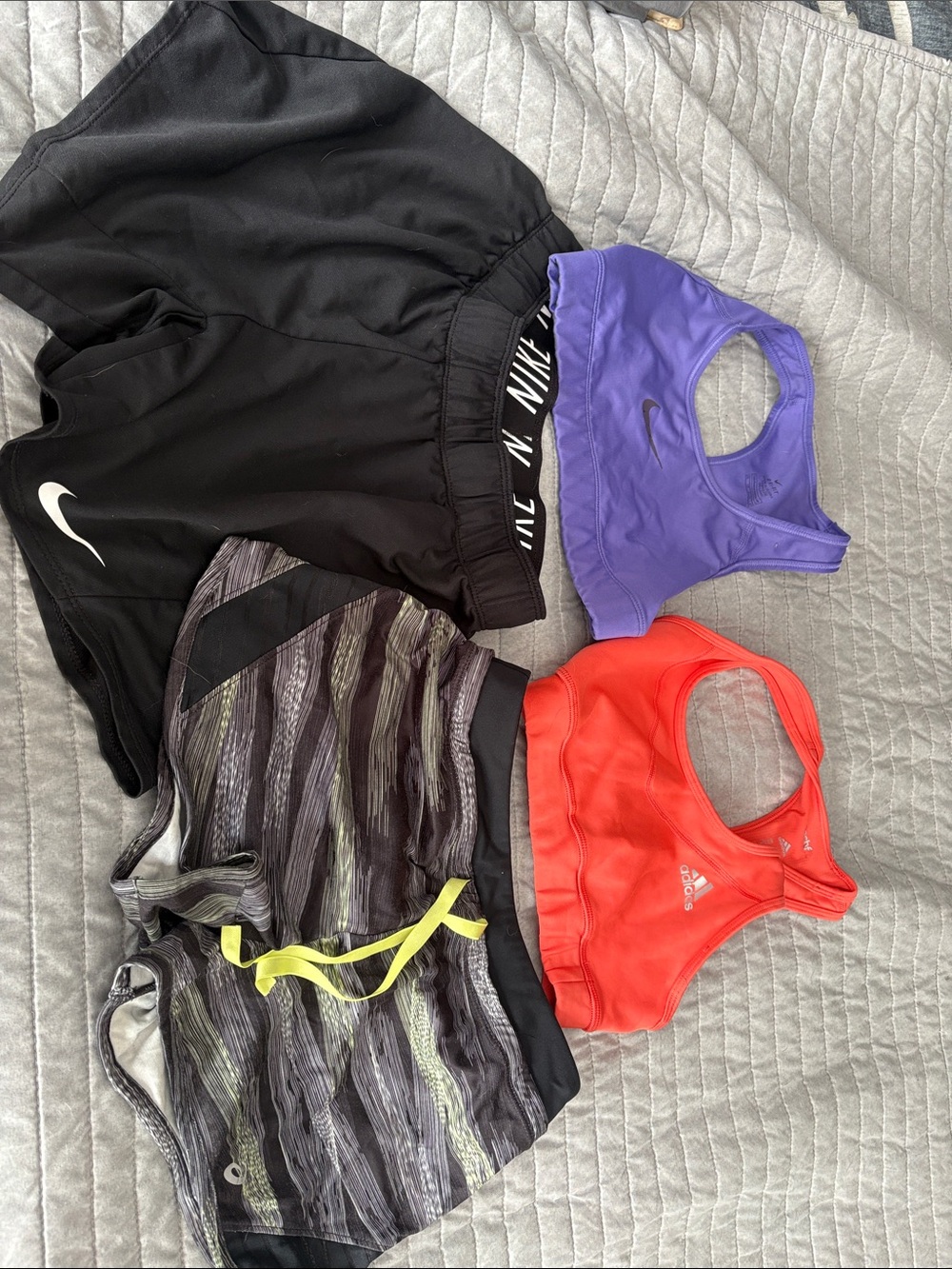 Nike Black Athletic Shorts with Purple Sports Bra and Red Bra